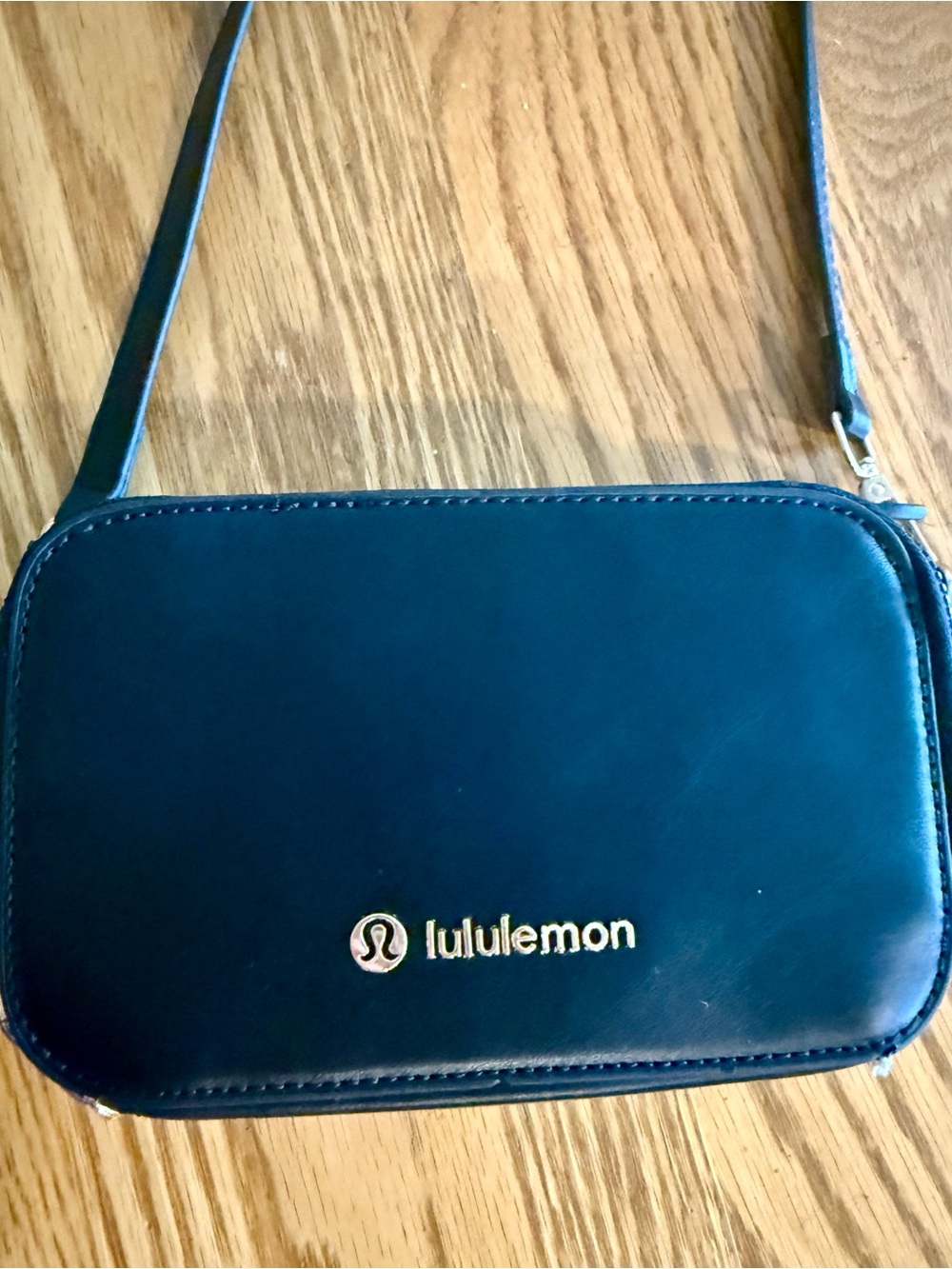 lululemon crossbody black leather with gold logo hardware
